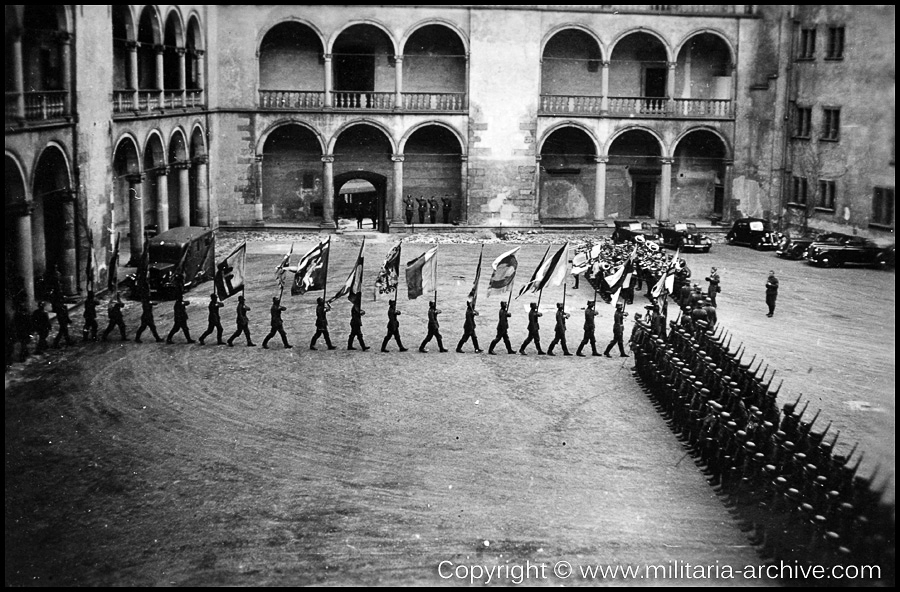 Polizei Bataillon 106, 9.Komp, Krakau, Wawel Castle, Poland May 19th 1940. German soldiers carrying the 430-year-old flags, which the German Order of Knights lost in the battle of Tannenberg July 15, 1410, against a twice as large Slav force.