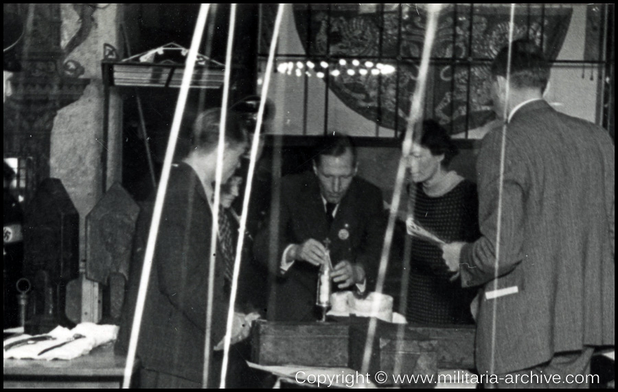 Kripo men at Katharinenkirche Nürnberg in 1938 as the items which had been removed from Vienna (Die Kleinodien des Heiligen Römischen Reiches - Die Reichskrone, die Heilige Lanze und das Reichsschwert..) were being setup. - Background the Mantle of King Roger II of Sicily c1134